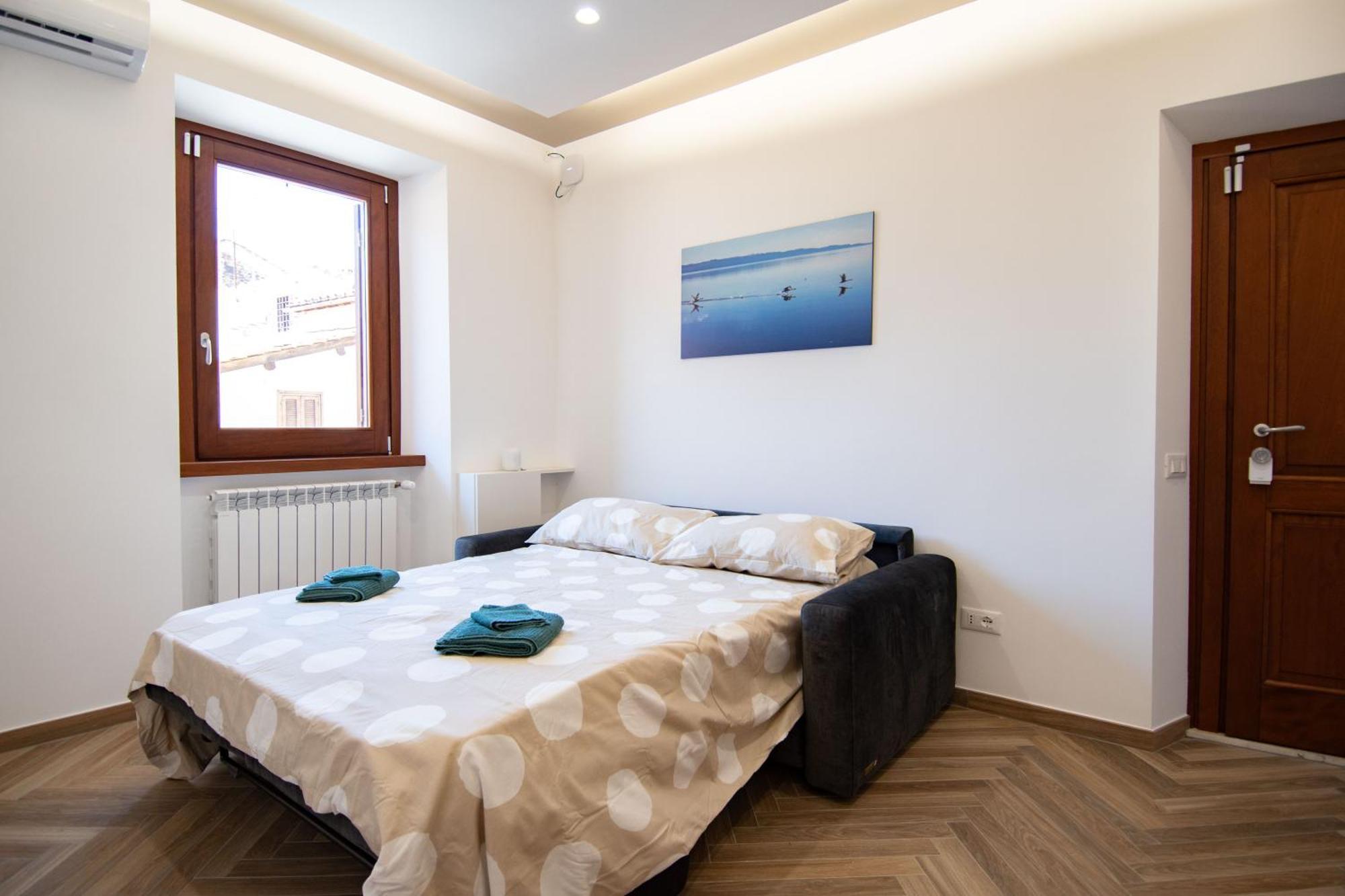 Finestra Sul Borgo Apartment เตรวินญาโน โรมาโน ภายนอก รูปภาพ